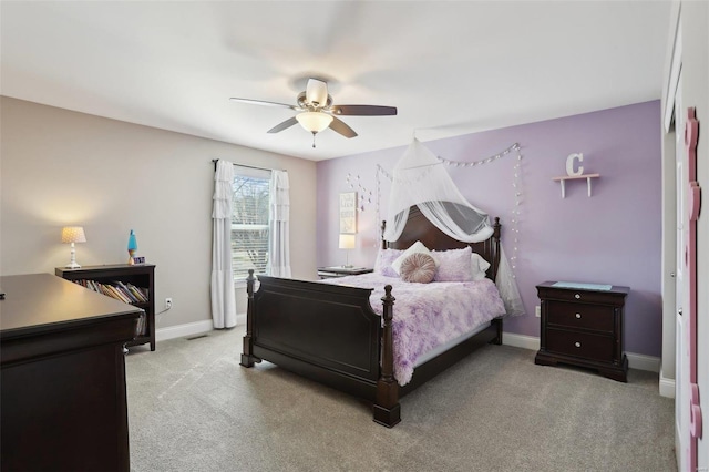 bedroom with a ceiling fan, carpet, and baseboards