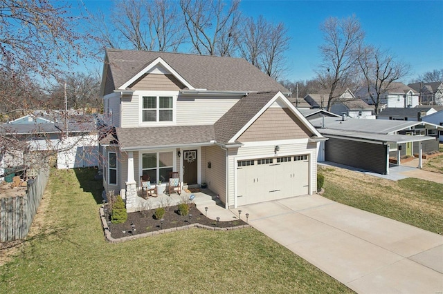 view of front of property featuring an attached garage, driveway, a front lawn, and fence