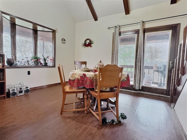 dining room with vaulted ceiling with beams, baseboards, and wood finished floors