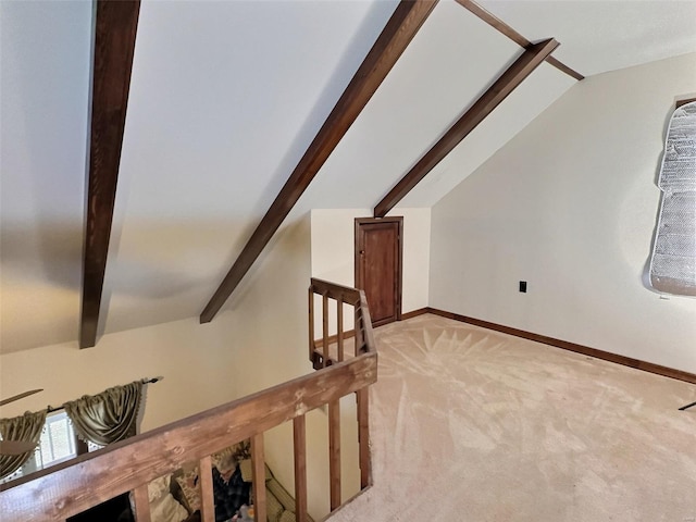 bonus room with vaulted ceiling with beams, baseboards, and light colored carpet