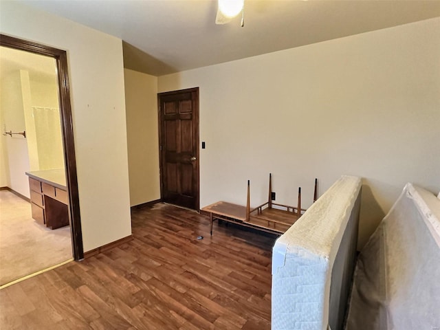 interior space featuring wood finished floors and baseboards