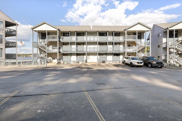 view of property featuring uncovered parking