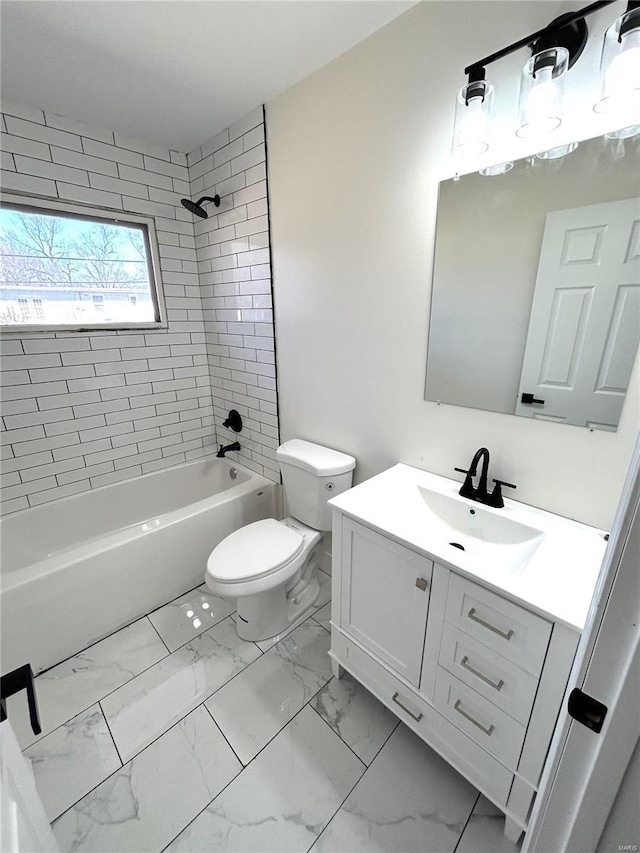 bathroom featuring marble finish floor, shower / bath combination, vanity, and toilet