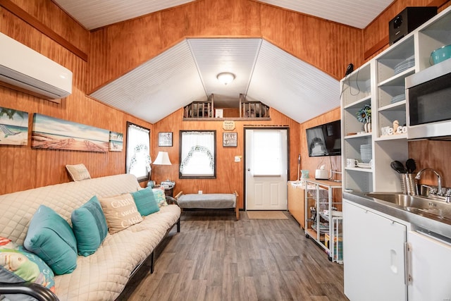 living area featuring lofted ceiling, dark wood-style floors, wood walls, and a wall mounted AC