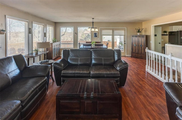 living room with baseboards and wood finished floors