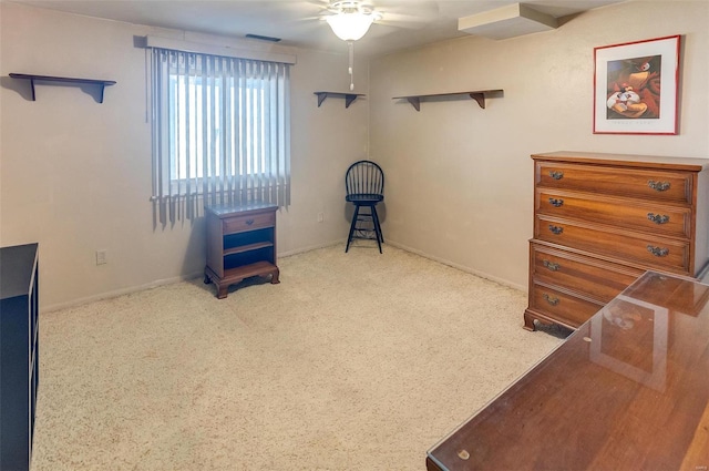 interior space featuring ceiling fan and carpet