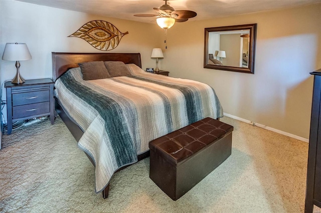 bedroom featuring ceiling fan, carpet, and baseboards