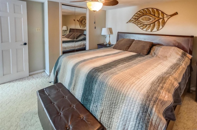 bedroom with a closet, carpet, a ceiling fan, and baseboards