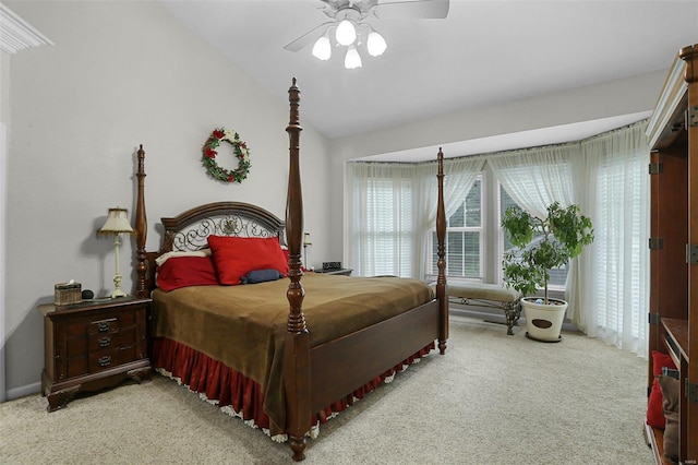 carpeted bedroom featuring a ceiling fan and lofted ceiling