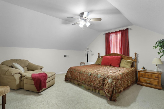 carpeted bedroom featuring baseboards, visible vents, vaulted ceiling, and a ceiling fan