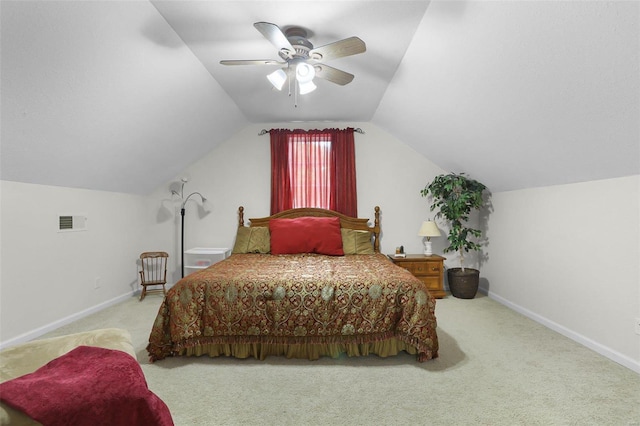 bedroom with lofted ceiling, ceiling fan, carpet flooring, visible vents, and baseboards