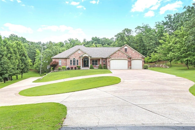 view of front of property featuring brick siding, roof with shingles, a garage, driveway, and a front lawn