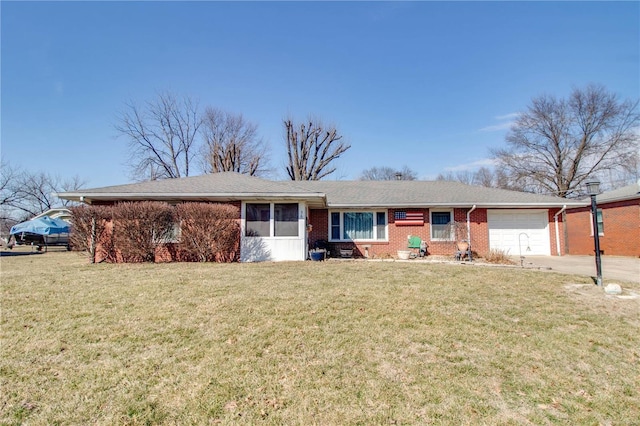 ranch-style house with a front lawn, brick siding, driveway, and an attached garage