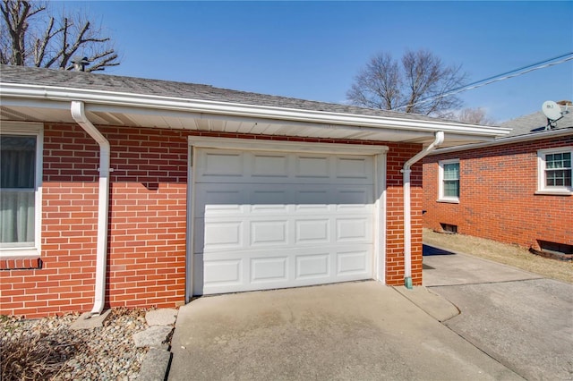 garage featuring driveway