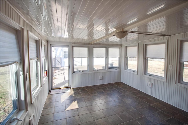 unfurnished sunroom with wooden ceiling