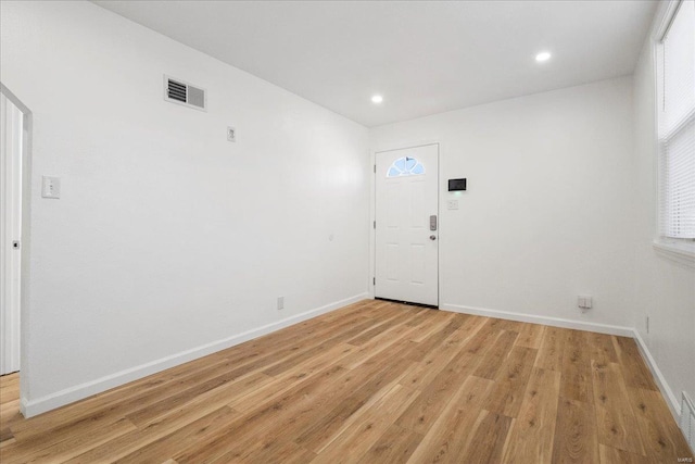 entrance foyer with recessed lighting, baseboards, visible vents, and light wood finished floors