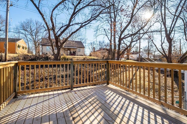 wooden deck featuring a residential view