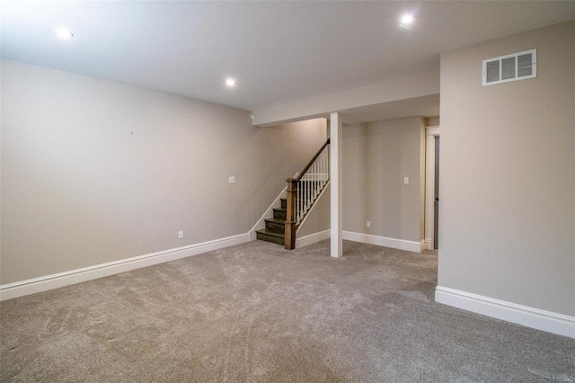 finished basement with carpet, recessed lighting, visible vents, baseboards, and stairs