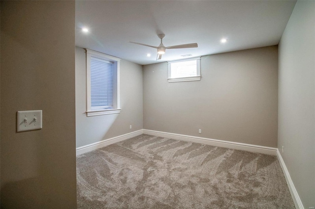 carpeted spare room with baseboards, a ceiling fan, and recessed lighting