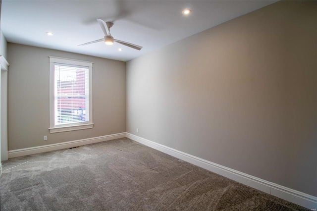 carpeted empty room featuring recessed lighting, a ceiling fan, and baseboards