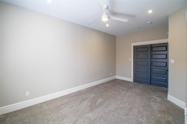 unfurnished bedroom featuring ceiling fan, recessed lighting, carpet flooring, baseboards, and a closet