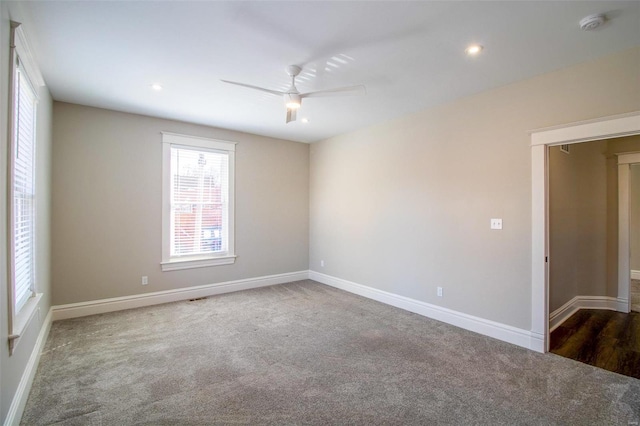 empty room with recessed lighting, visible vents, carpet flooring, ceiling fan, and baseboards