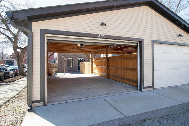 garage featuring a carport and a garage door opener