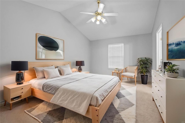 bedroom with vaulted ceiling, ceiling fan, and light colored carpet