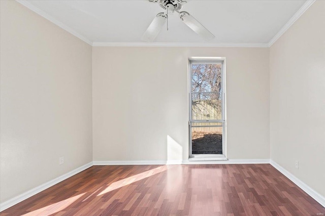 unfurnished room featuring a ceiling fan, crown molding, baseboards, and wood finished floors