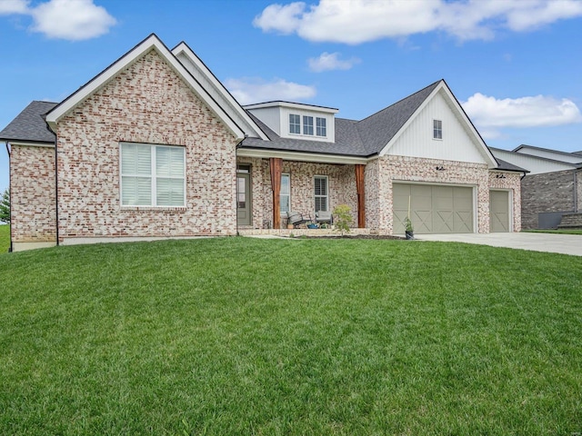 view of front facade with a front yard, concrete driveway, and brick siding