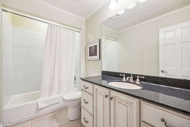 full bathroom featuring vanity, ornamental molding, shower / bath combo with shower curtain, tile patterned floors, and toilet