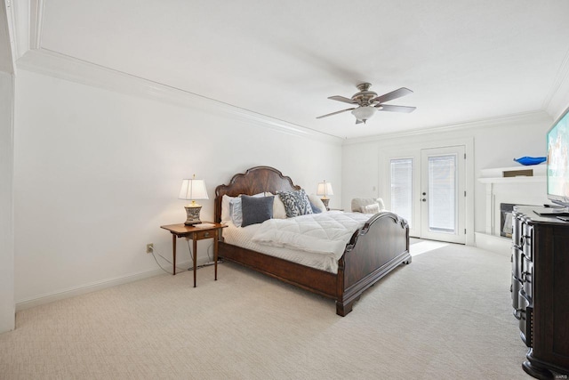 bedroom featuring baseboards, ornamental molding, light carpet, a ceiling fan, and access to outside