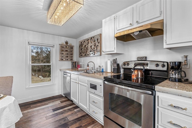 kitchen featuring dark wood-style floors, stainless steel appliances, white cabinets, a sink, and under cabinet range hood