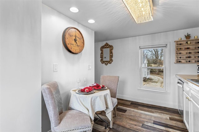 dining room featuring baseboards, dark wood-style flooring, and recessed lighting