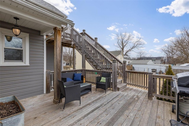 wooden terrace featuring stairs, fence, and grilling area