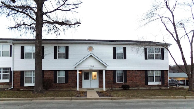 view of front of house featuring brick siding