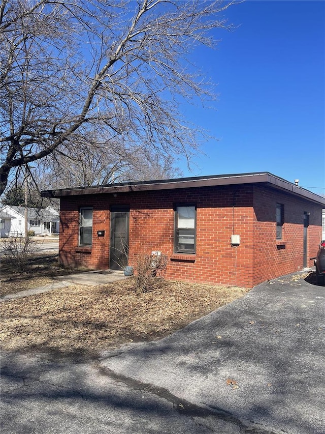 view of side of property with brick siding