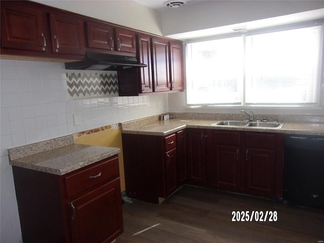 kitchen with a sink, under cabinet range hood, reddish brown cabinets, decorative backsplash, and dishwasher