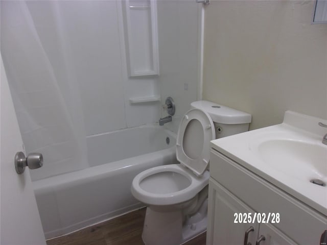 full bath with toilet, vanity, shower / bath combination, and wood finished floors