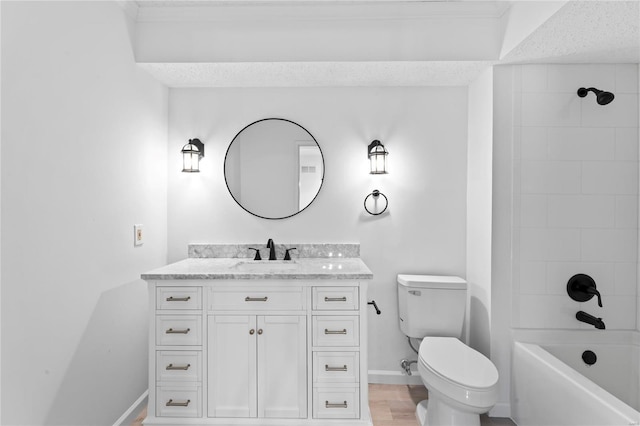 bathroom with toilet, baseboards, shower / washtub combination, and vanity