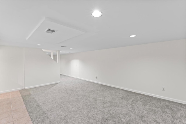 interior space featuring visible vents, baseboards, tile patterned flooring, carpet flooring, and recessed lighting