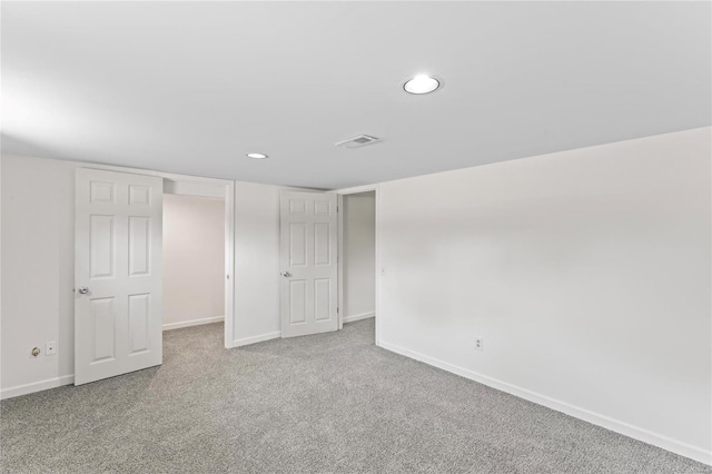 unfurnished bedroom featuring visible vents, baseboards, carpet flooring, and recessed lighting