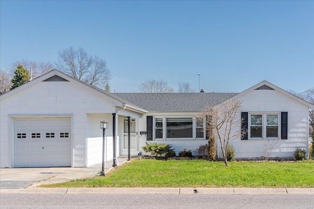 ranch-style home featuring a garage, a front yard, and roof with shingles