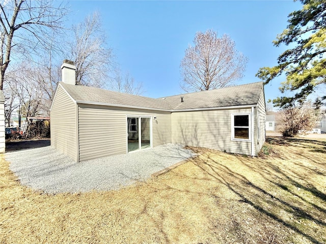 rear view of house with a chimney