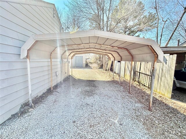 view of car parking featuring a carport and driveway