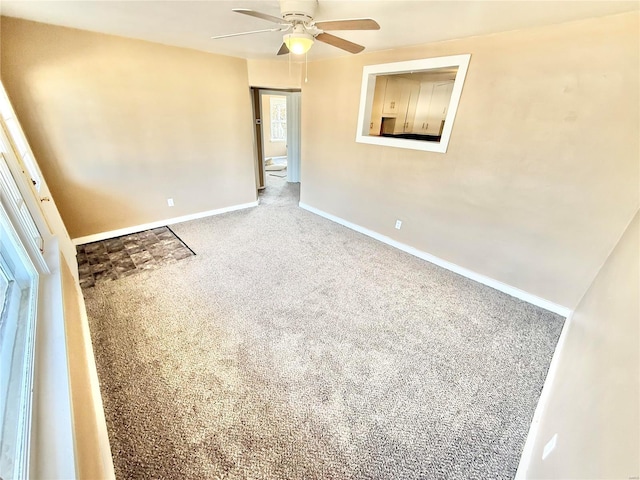 unfurnished bedroom featuring ceiling fan, carpet flooring, and baseboards