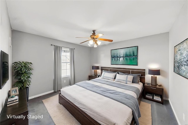 bedroom featuring ceiling fan and baseboards