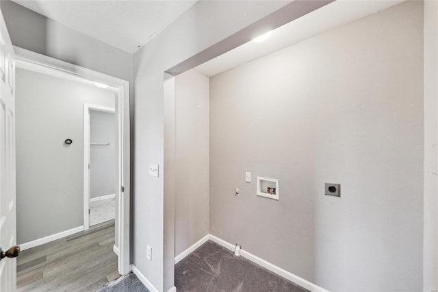 washroom featuring baseboards, hookup for a gas dryer, wood finished floors, hookup for a washing machine, and electric dryer hookup