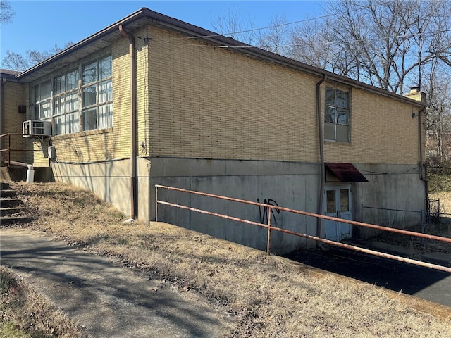 view of home's exterior featuring brick siding