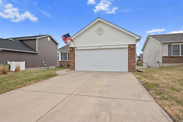 ranch-style house with an attached garage, a front yard, concrete driveway, and brick siding